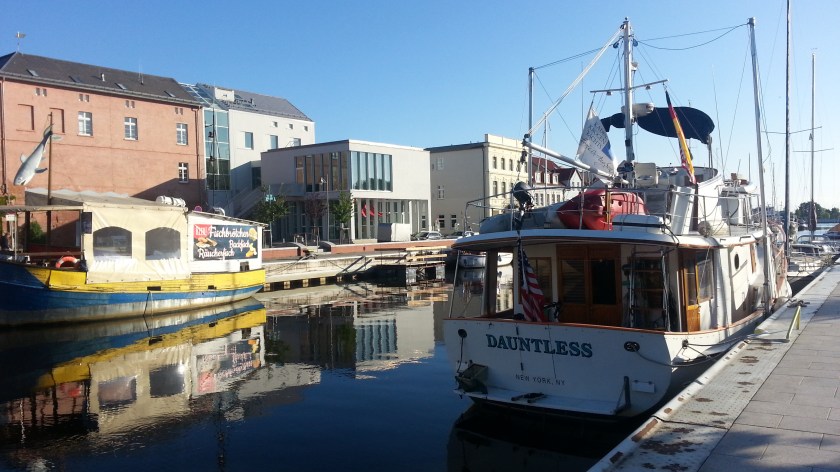 Dauntless in Ueckermünde with the fish boat restaurant to the left.
